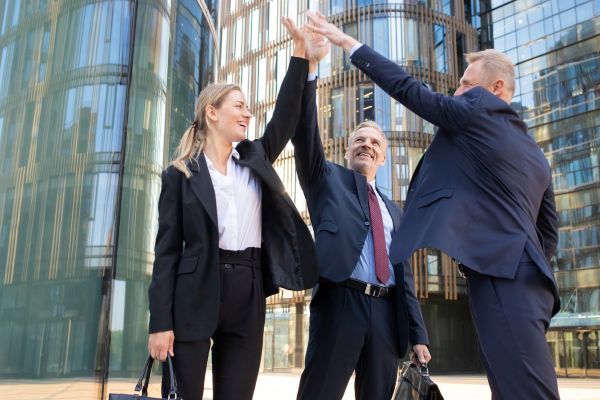 three-cheerful-businesspeople